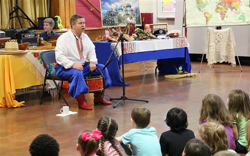 Playing a traditional drum 